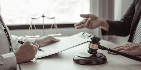 Employment tribunal Meeting between employment law solicitors, employer and employee
