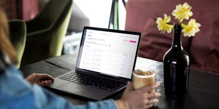 Payroll software and clocking in and out A woman using BrightHR