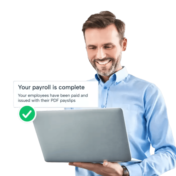 A man using a laptop receiving confirmation of completed payroll processes