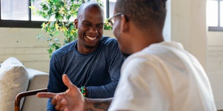 Mental health policy Two men talking about mental health and its importance
