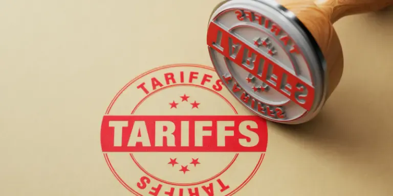 A red inked stamp with the word tariffs
