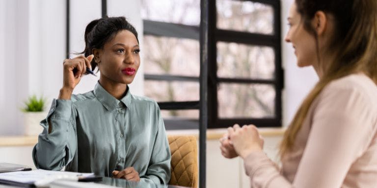 Return to work interviews A female employer and employee in a return to work interview.