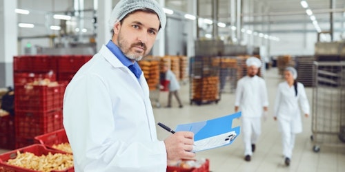 Food inspector in a food warehouse inspecting