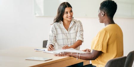 Female employer and employee in a capability meeting.