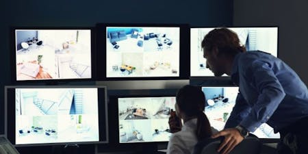 Workplace surveillance Managers monitoring a workplace using surveillance footage