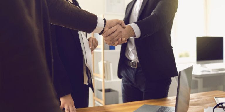 Trade union Employer and trade union rep shaking hands
