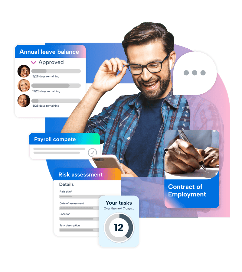 BrightHR HRIS A man with glasses is smiling while holding a phone to his ear, possibly engaged in a conversation. He is wearing a blue plaid shirt and has a beard. The man is using BrightHR on his mobile device.