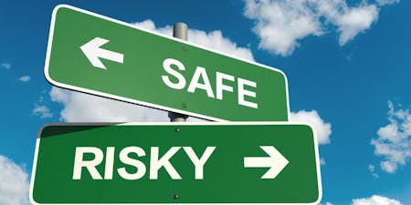 Keeping high-risk workplaces safe with SWMS Two sign posts pointed to safety and the other to risks
