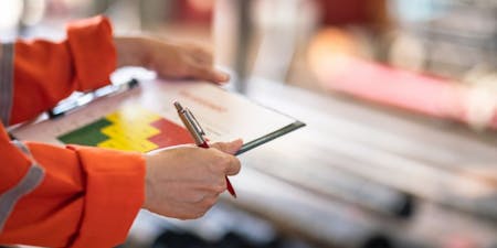 Fire Risk Assessments A business owner completing a fire risk assessment
