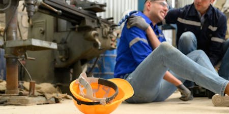 Accident at work A man in pain after falling at work resulting in a reportable injury