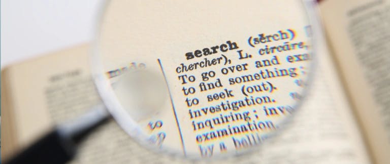 Magnifying glass highlighting the word search