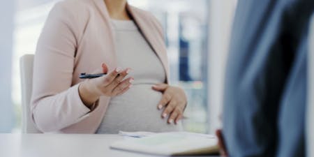 Occupational maternity pay A pregnant employee signing a contract with their employer
