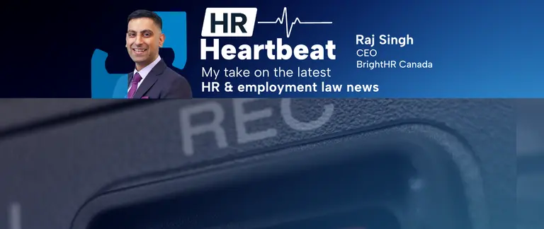 Half of the lens of a camera showing the record symbol