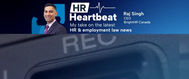 Half of the lens of a camera showing the record symbol