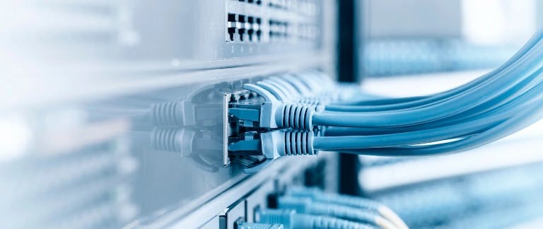 Image of plugs going into the back of a screen