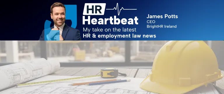 blog header with an image of a safety helmet and building plans on a table with work site in background