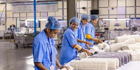 Manufacturing workers smiling