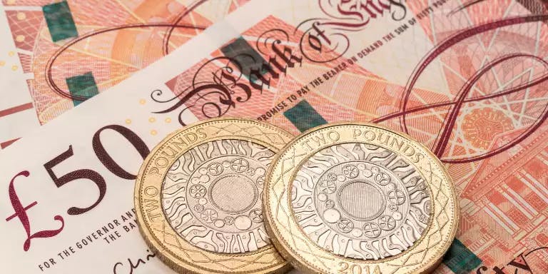 An image of British pounds, notes and coins