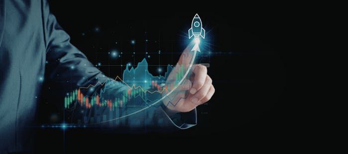A person in a suit is holding a device that displays a graph of a stock market. The background features a dark blue gradient, with lines and shapes that suggest the movement of the market.