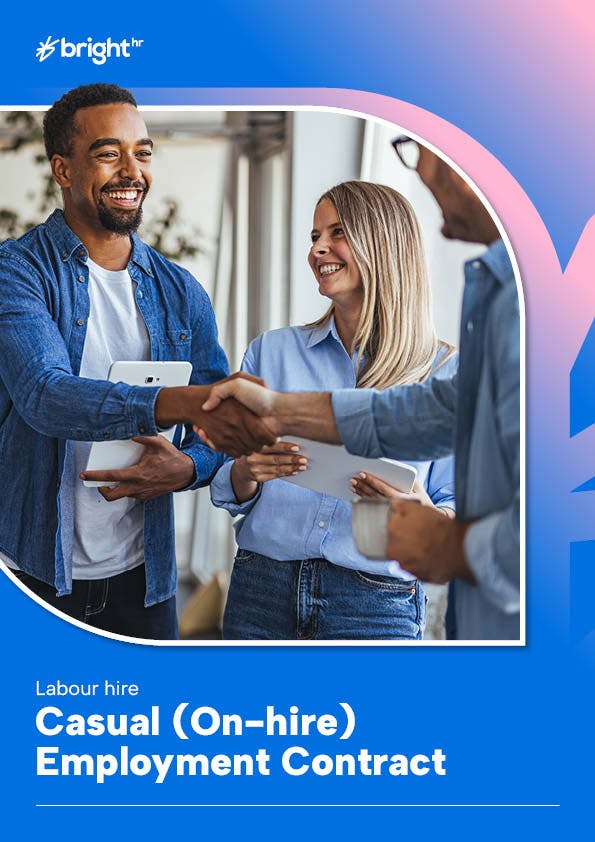 An employer and employee are shaking hands.
