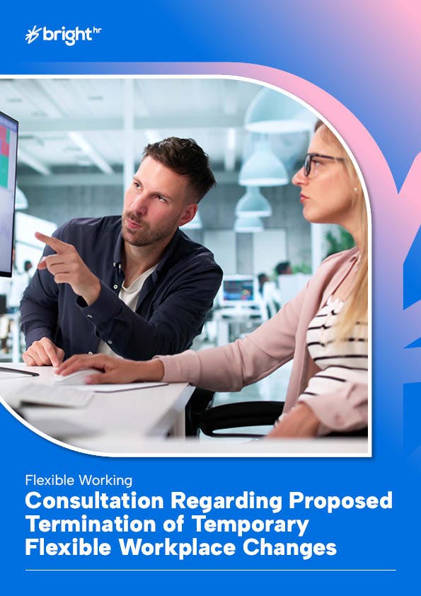 The image features a man and a woman in an office setting. The man is pointing at a computer screen, suggesting some form of communication or presentation.