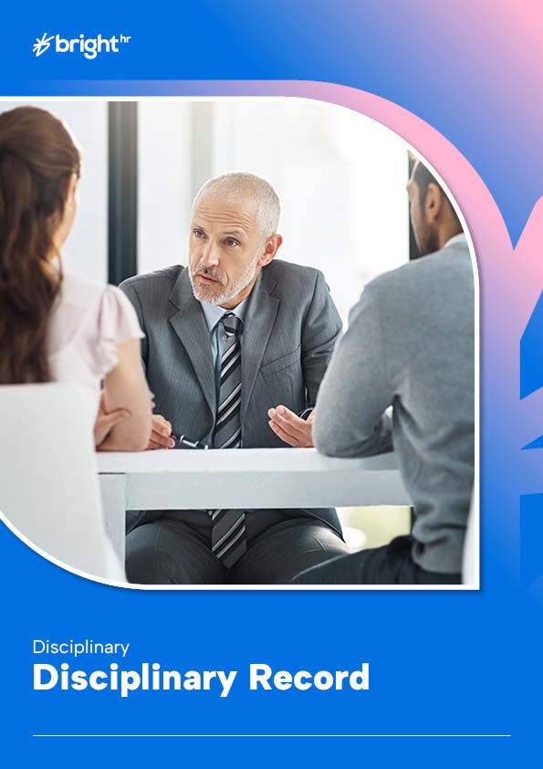 The image features a man in a gray suit, seated at a white table. He is engaged in a conversation with a woman seated across from him.