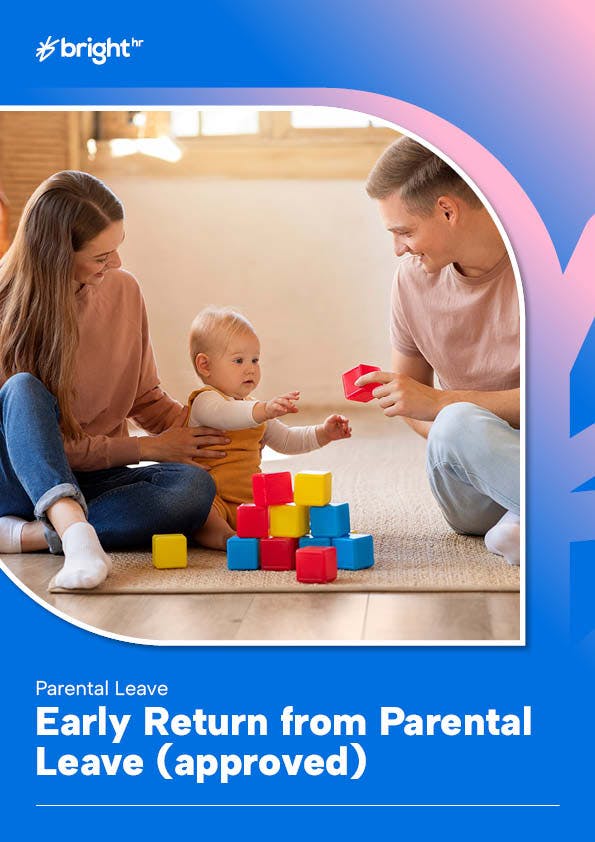 A family is playing with a baby and a red toy on a wooden floor.