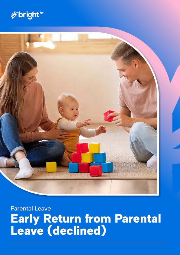A family is playing with a baby and a colorful playpen on a wooden floor.