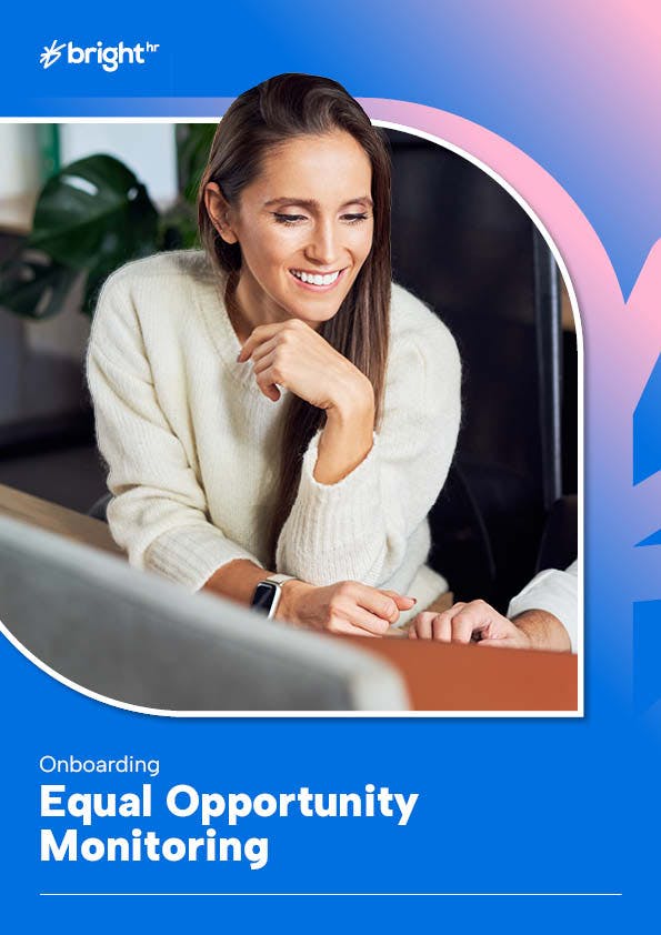 The image features a woman with long brown hair, wearing a white sweater, sitting at a desk with a computer in front of her.