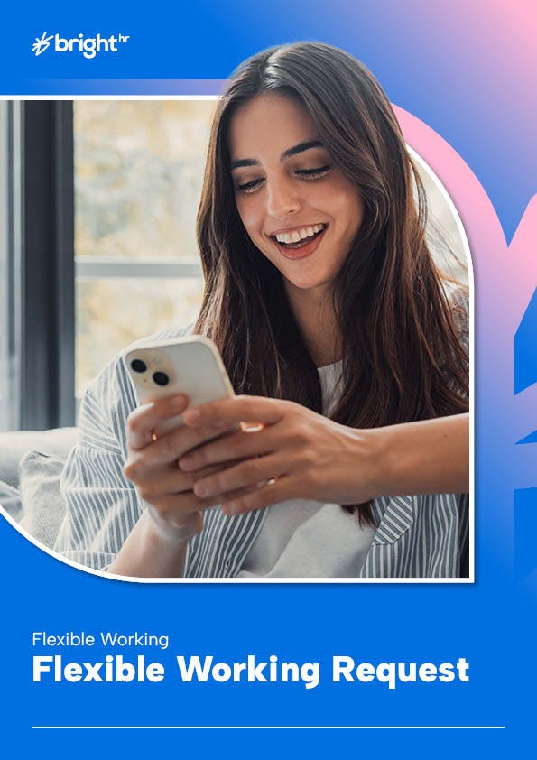 A woman with long brown hair is smiling while using her white iPhone.