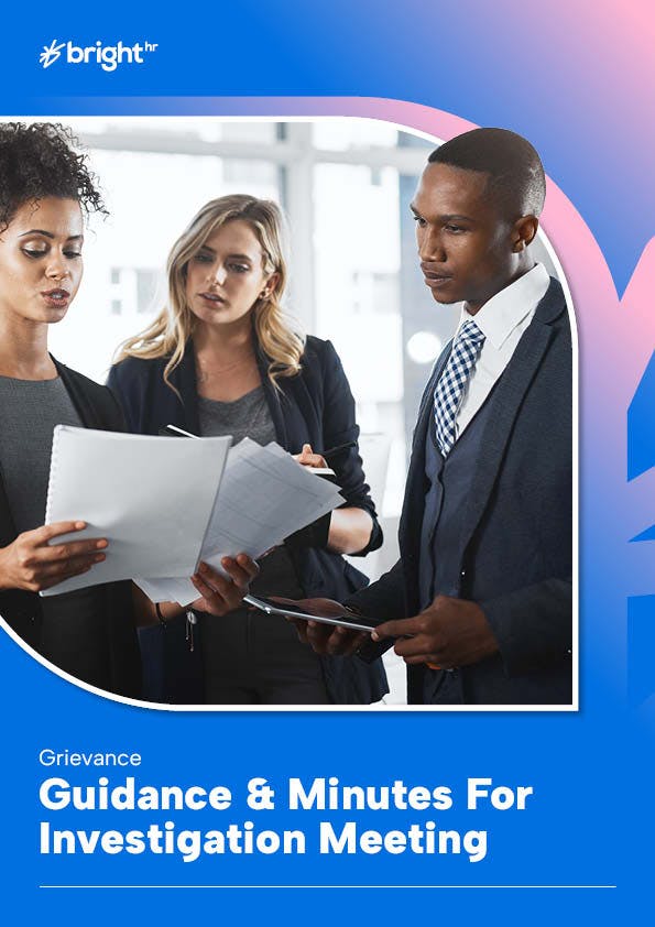 Employees in a discussion looking at documents