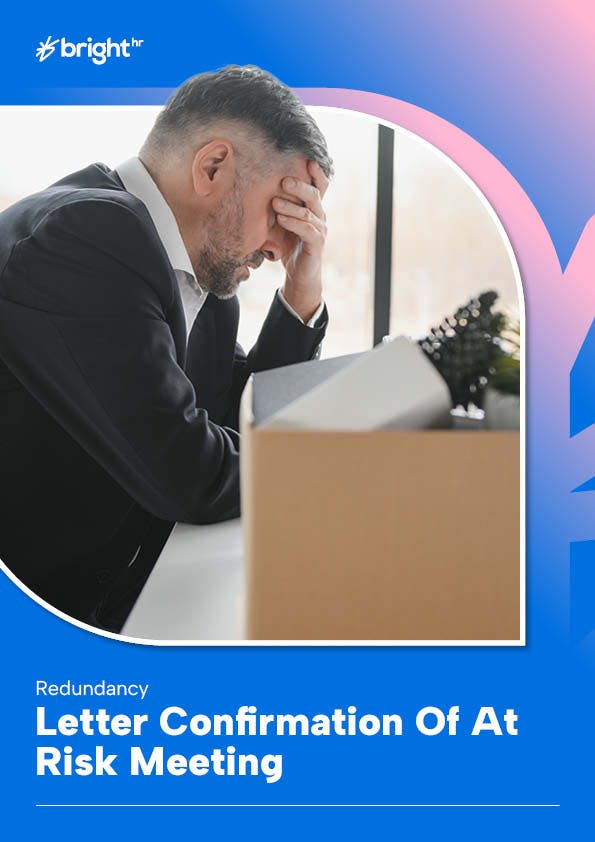 employee at desk stressed with belongings packed in box