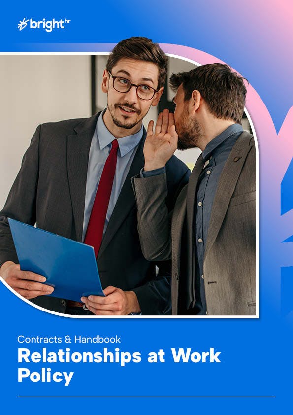 employee whispering to another employee