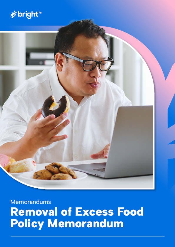 Employee eating donut while working