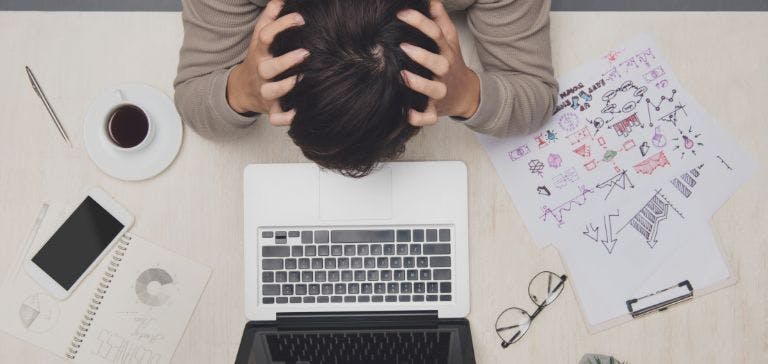 Stressed office worker at desk
