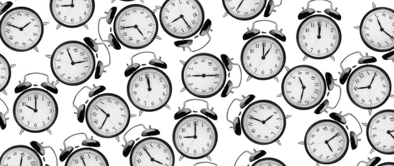 A photo of alarm clocks showing different times