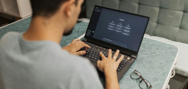 Employee using chatgpt on laptop