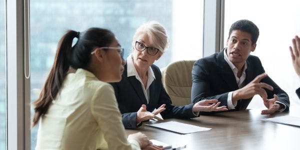 employees in meeting arguing employees in meeting arguing