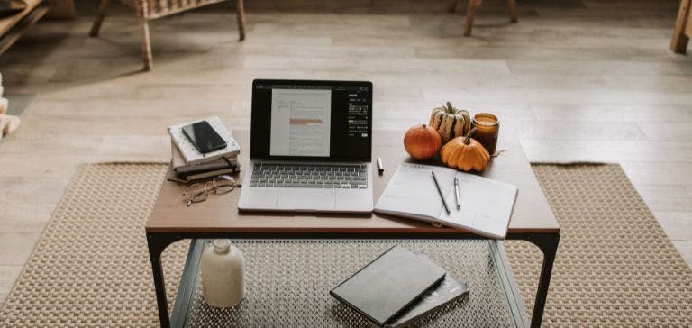 picture of home office with laptop and books