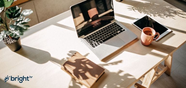 picture of home office with laptop and books