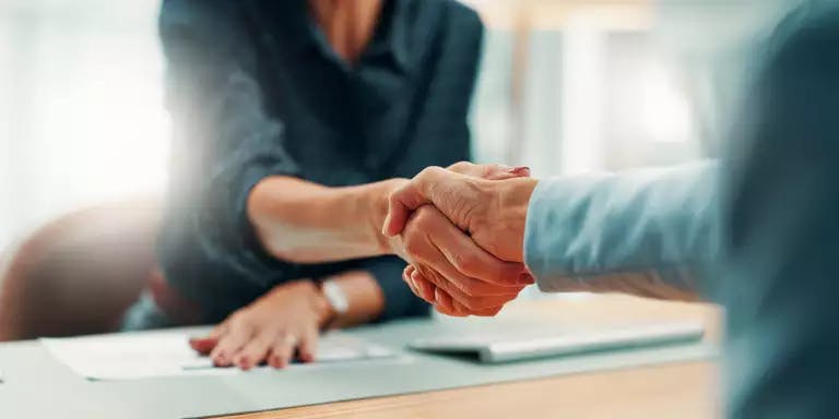 Manager Handshake Bel