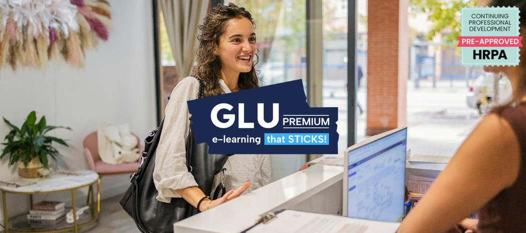 A customer at a retail desk. In the foreground is the logo for GLU Premium: eLearning that sticks and a HRPA approval badge.