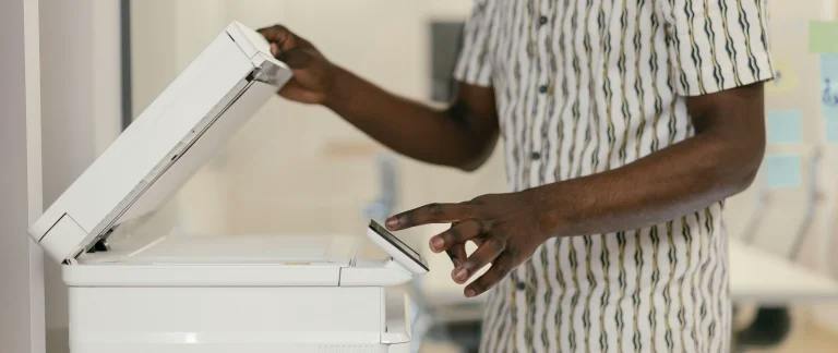 A person photocopying a document