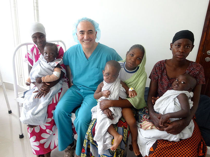 Dr. Alizadeh sitting with patients.