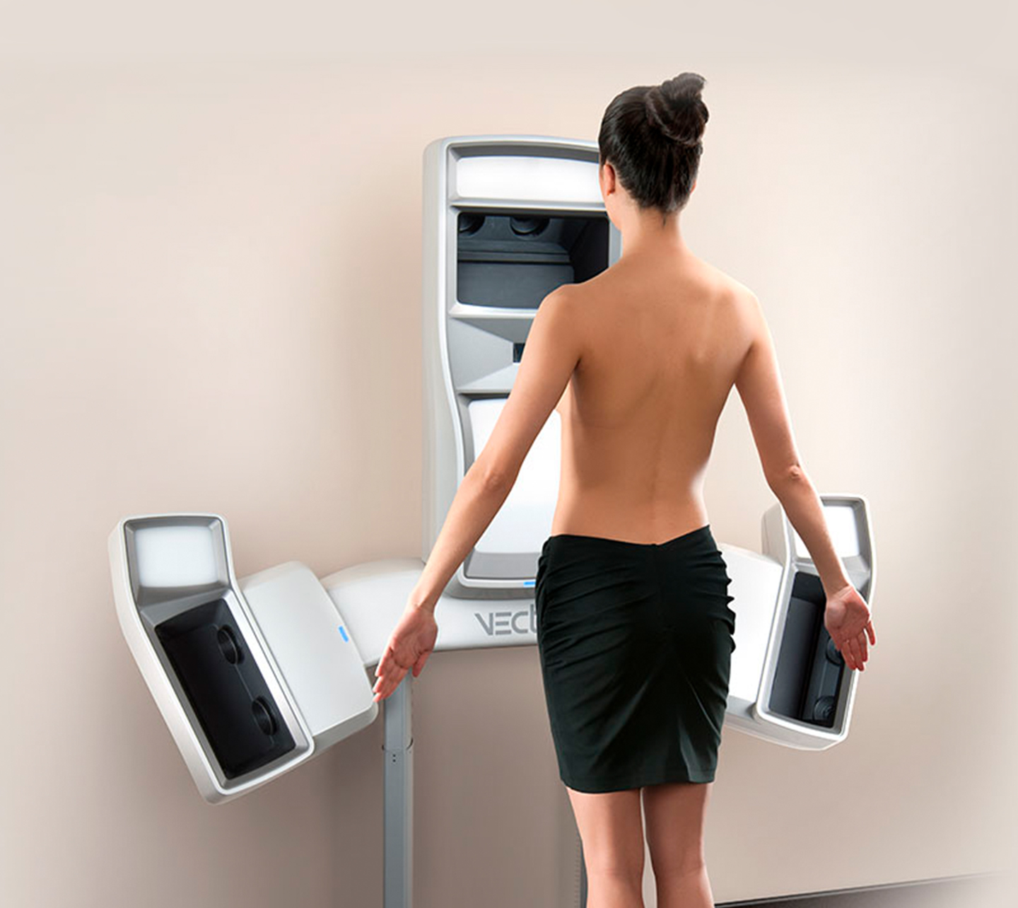 Woman standing in front of VISIA Complexion Analysis System getting scanned.