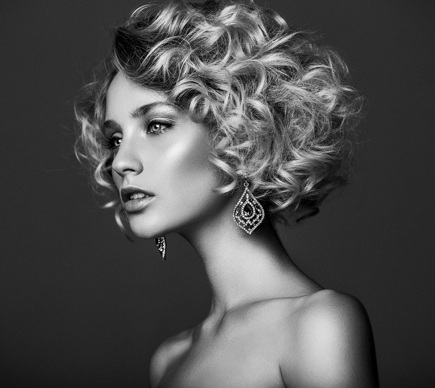 Black and white of model with bare shoulders.