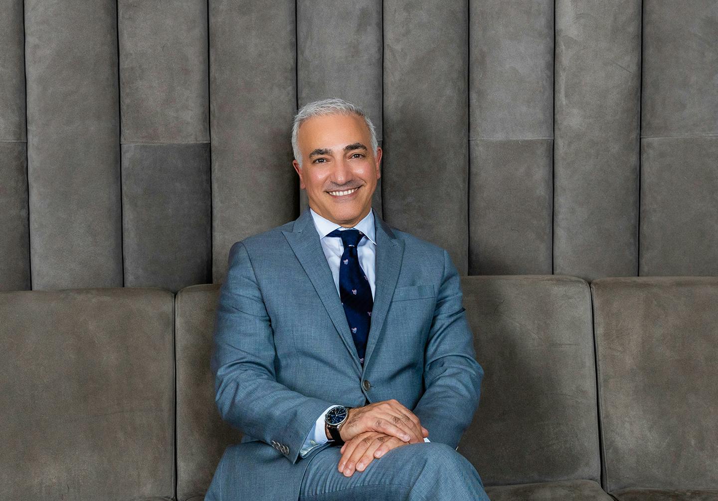 Dr. Alizadeh sitting down - a board-certified plastic surgeon in NYC