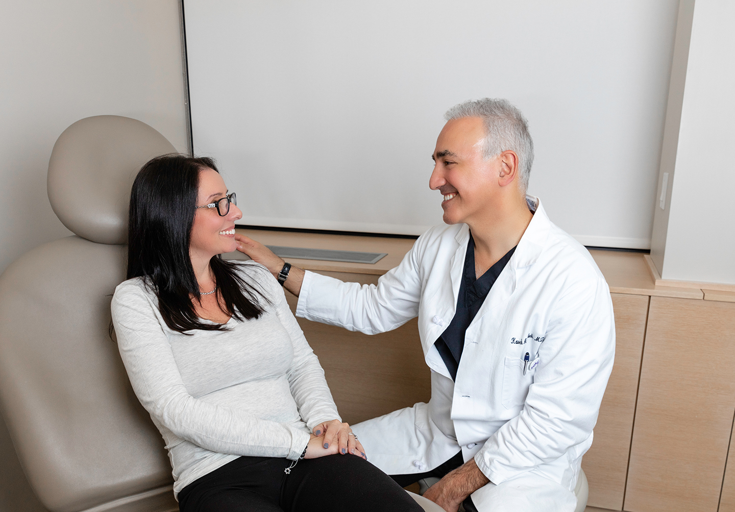 Dr. Alizadeh meeting with a patient.