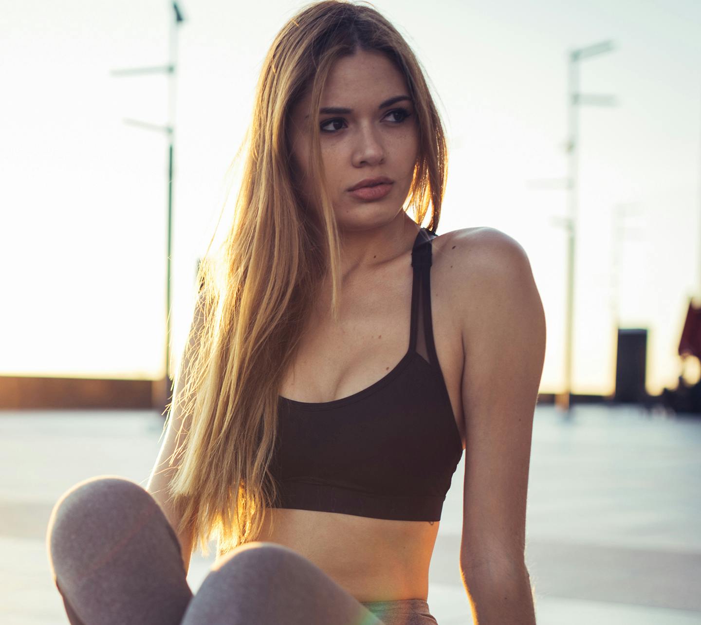 Woman posing with a sports bra.