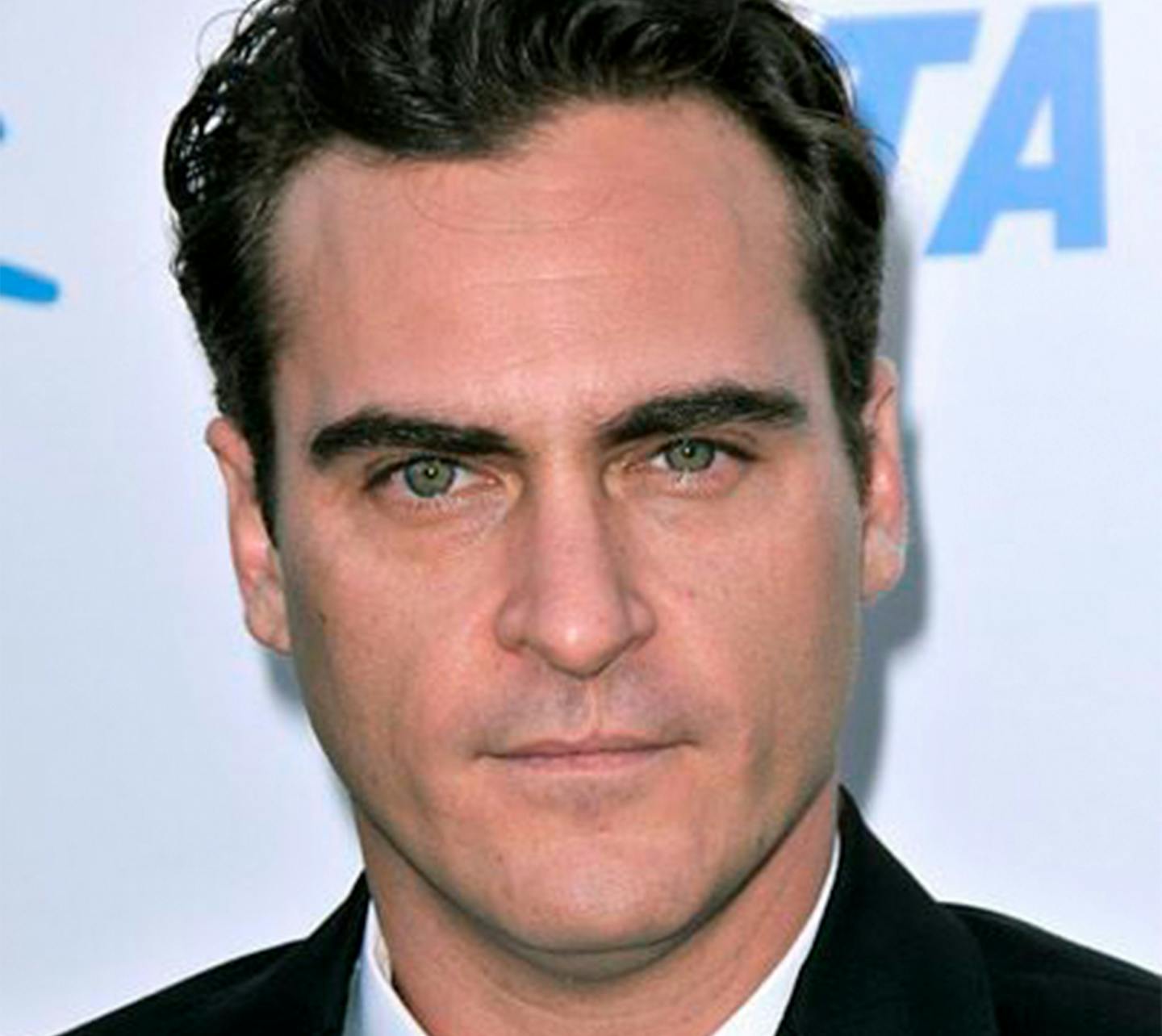 Joaquin Phoenix with scar on his upper lip.